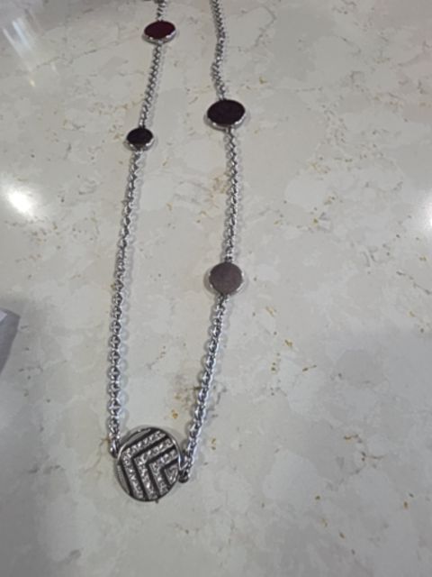 Necklace round charms on long chain